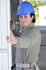 woman controlling size of finished pvc window