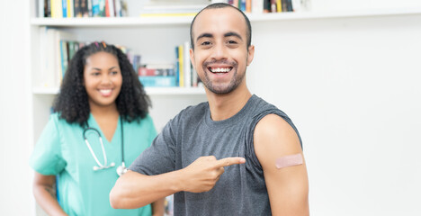 Laughing mexican man after third vaccination against Covid 19