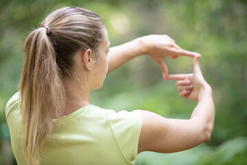 woman hands making frame gesture outdoor