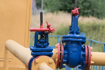 Gas flanged valve with pipe in nature.