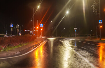 Crosswalk after rain in the evening.