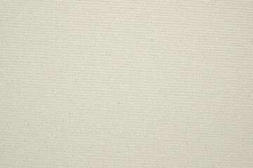 A dense industrial sheet of paper with a textured surface