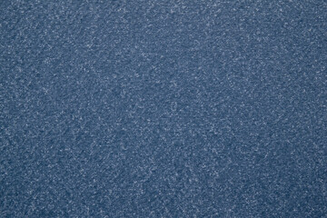 A dense industrial sheet of paper with a textured surface