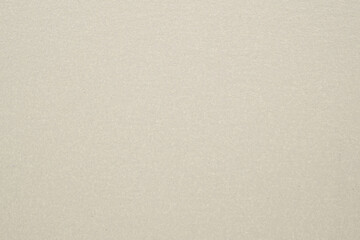 A dense industrial sheet of paper with a textured surface