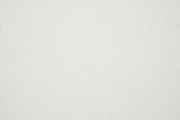 A dense industrial sheet of paper with a textured surface