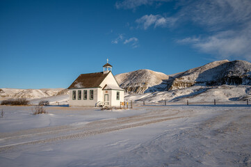 Winter at the old wooden pioneer church in the ghost town of Dorothy in Alberta, Canada