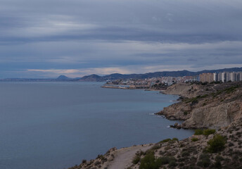 Obraz premium a beautiful coastline, beach, coves and cliffs in Villajoyosa, Alicante, Spain. Walking for the mountain route.
