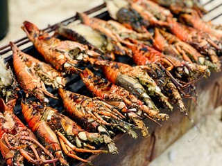 Giant Grilled Lobsters Are Cooking on Charcoal Stove at Nakupenda Island, Zanzibar, Tanzania