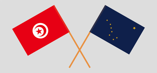 Crossed flags of Tunisia and the State of Alaska. Official colors. Correct proportion