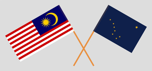 Crossed flags of Malaysia and the State of Alaska. Official colors. Correct proportion