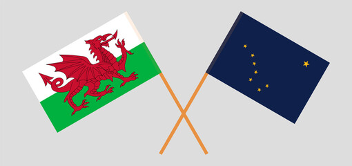 Crossed flags of Wales and the State of Alaska. Official colors. Correct proportion