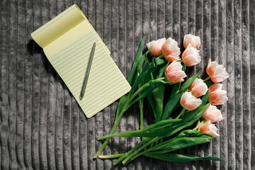 flowers notepad and coffee on the table. valentine's day concept