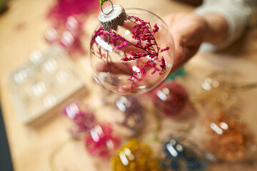 Beautiful glass ball with dried flowers inside