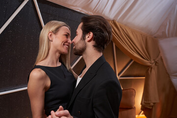 Romantic couple is dancing together in restaurant