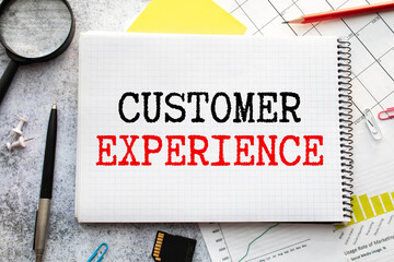 Customer Experience. text on white paper over torn paper background.