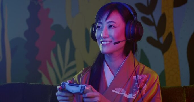 Woman in Japanese Dress loses while playing video game