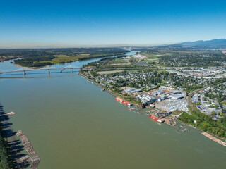 Fototapeta premium Stock Aerial Photo of Hammond Saw Mill and Golder Ears Bridge Maple Ridge BC, Canada