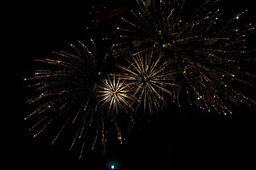 Very beautiful fireworks against the black sky. Graphic resource for design. Underlay or undercoat