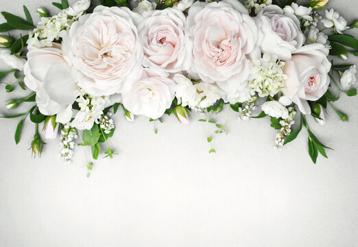 Delicate blooming festive roses and light pink flowers background, blossoming rose flower soft pastel frame, bouquet floral card