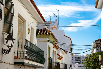 A typical street in old city Estepona with colorful flower pots. Estepona, Andalusia, Spain