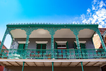 Balcony with Beautiful Green Wrought Iron in the French Quarter of New Orleans, Louisiana, USA