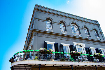 A Wrap-Around Balcony is Decorated with Blooming Flowers and Green Garland for Mardi Gras in the French Quarter of New Orleans, Louisiana, USA