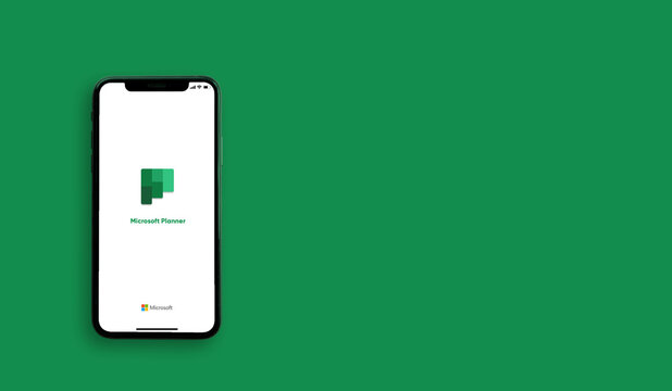Microsoft Planner application on the smartphone screen on green background. Copy space. Top view : Chiang Mai, Thailand, 1 January 2022