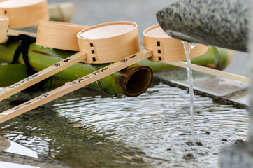 Bowls for pouring water and washing hands at the entrance of Hiroshima Castle in Japan
