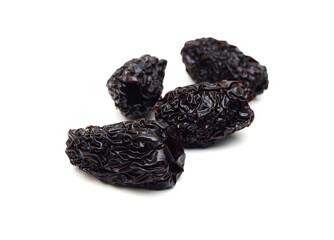 Black dried jujube on white background.