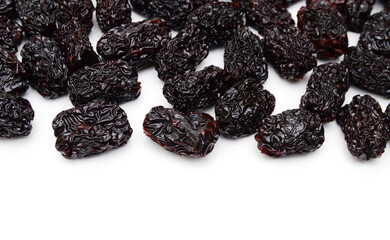 Black dried jujube on white background.