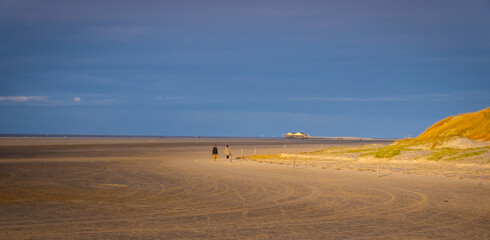 The beach and Wadden Sea of St Peter Ording in Germany is a popular tourist attraction - travel photography