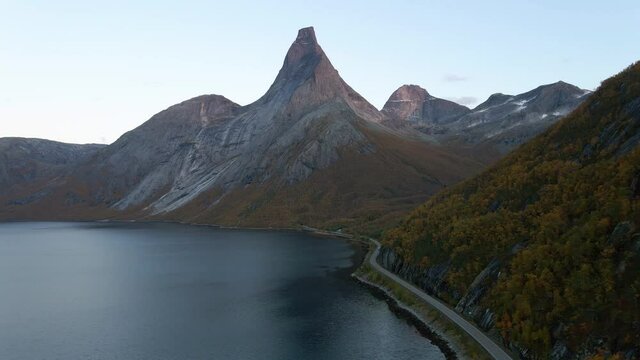 Aerial view around the Stetinden mountain, autumn sunset, in Norway - circling, drone shot