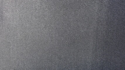 Black velvet background. The texture of the black cloth. Close up, selected focus