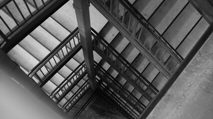 Stairwell Black and White Downwards Look Spiral Stairs