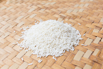 Close up rice grain on wooden basket
