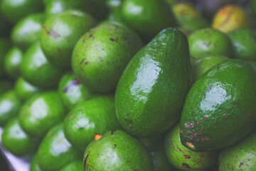 Fresh Avocadoes for sale on market	

