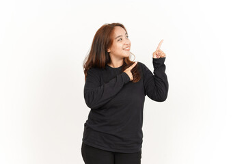 Obraz premium Pointing Aside Of Beautiful Asian Woman Wearing Black Shirt Isolated On White Background