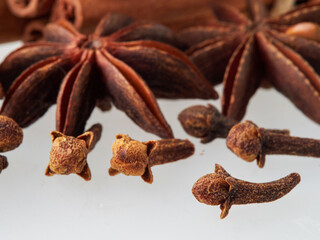 Star anise and cinnamon stick isolated on white background, top view