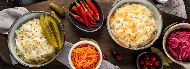 Pickled vegetables on wooden background. Salting vegetables.