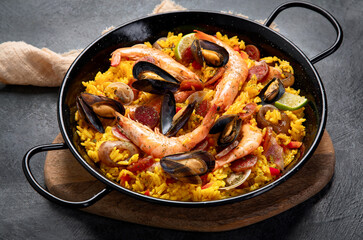 Seafood Paella on gray background.