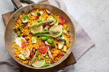 Vegan Paella on gray background.