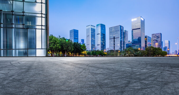 Panoramic skyline and modern commercial office buildings with empty road. Asphalt road and cityscape.