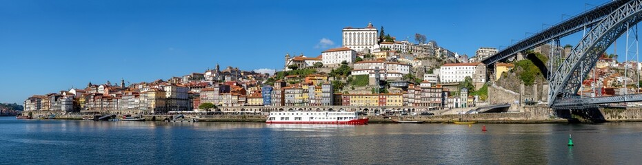 Fototapeta na wymiar Panorama of the old town of Porto with the river Douro and the famous iron bridge