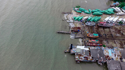 Fototapeta na wymiar local Shipyard from aerial view with old building and ships on the dock in Na Kluea, Bang la Mung, Chonburi, Thailand