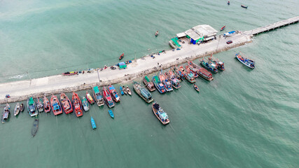 local Shipyard from aerial view with old building and ships on the dock in Na Kluea, Bang la Mung, Chonburi, Thailand