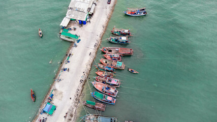 local Shipyard from aerial view with old building and ships on the dock in Na Kluea, Bang la Mung, Chonburi, Thailand