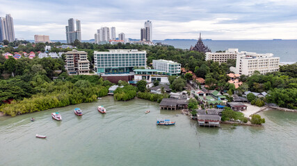 Aerial view of local Asian fishing boats on land next to the town of Bang Lamung and Na Kluea seafood market, Chonburi, Thailand.