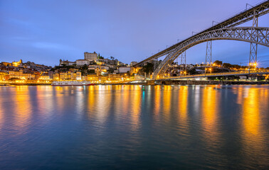 Fototapeta na wymiar The old town of Porto with the river Douro and the famous iron bridge at dusk