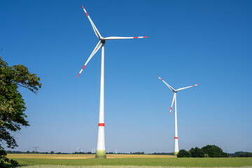 Fototapeta premium Wind turbines in a rural landscape seen in Germany
