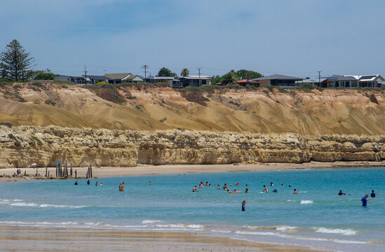 Holiday makers swimming at Port Willunga beach, South Australia 